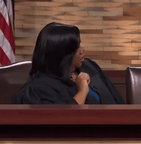 Woman in Judge's Robe at Desk