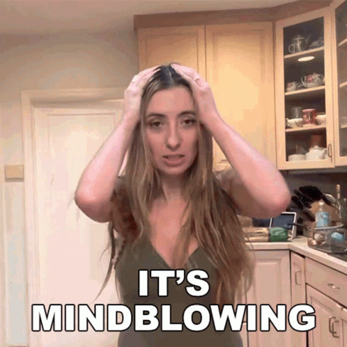 Woman in Kitchen Hands on Head Saying Mindblowing