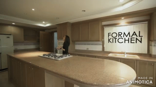 Woman in Kitchen Saying Formal Kitchen