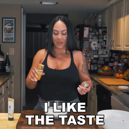 Woman in Kitchen Saying I Like the Taste