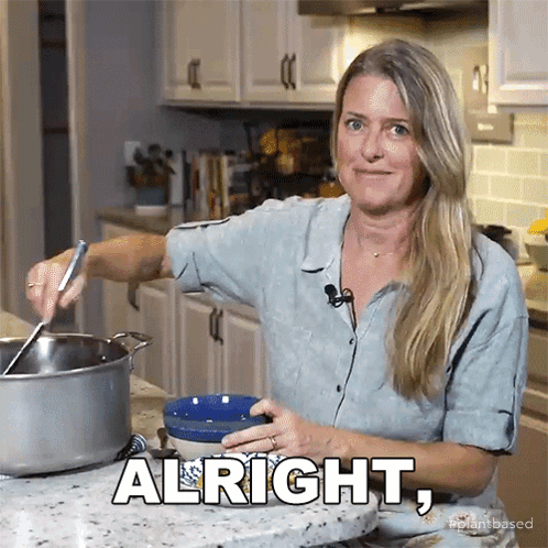 Woman in Kitchen With Alright on Counter