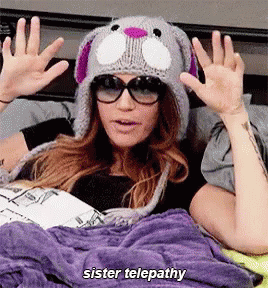 Woman In Knitted Hat Sunglasses Says Sister Telepathy GIF