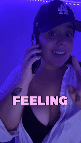 Woman in LA Hat Talking on Phone
