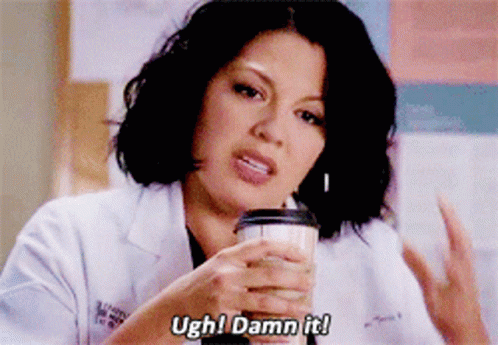 Woman in Lab Coat Holding Coffee Says Ugh Damn It