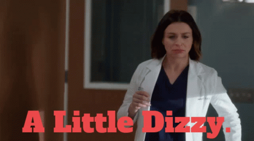 Woman in Lab Coat Saying A Little Dizzy