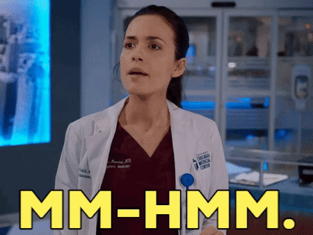 Woman In Lab Coat Saying Mm-Hmm GIF