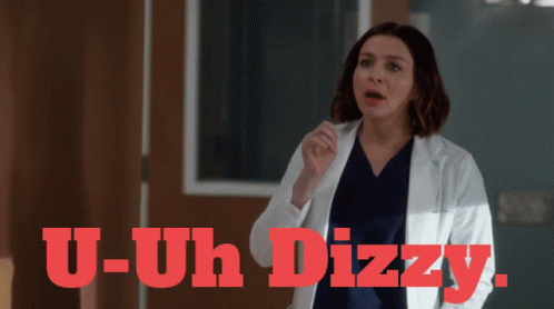 Woman in Lab Coat Saying U-Uh Dizzy