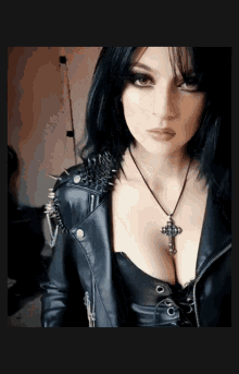 Woman in Leather Jacket and Cross Necklace