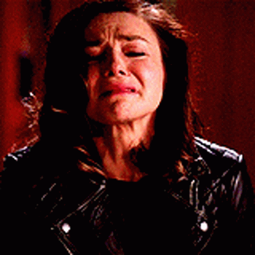 Woman in Leather Jacket Crying With Mouth Open