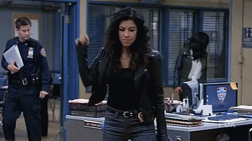 Woman in Leather Jacket Facing Police Officer