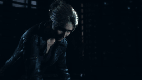 Woman In Leather Jacket In Dark Room GIF