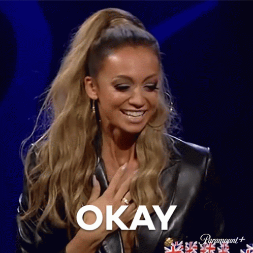 Woman in Leather Jacket Saying Okay
