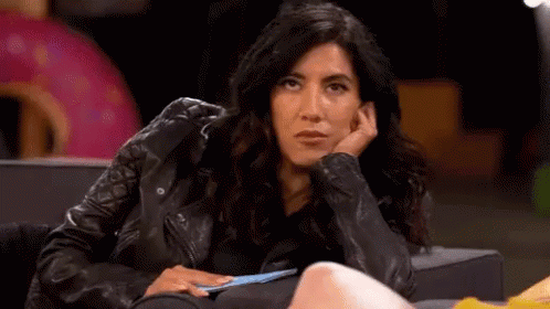 Woman in Leather Jacket Sitting with Hand on Face