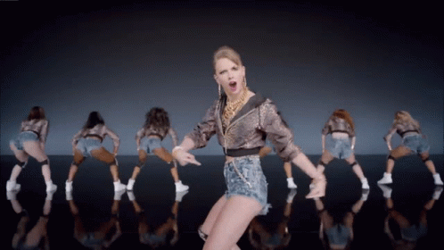 Woman in Leopard Print Jacket Dancing With Dancers