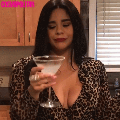 Woman in Leopard Print Shirt Holding Martini Glass