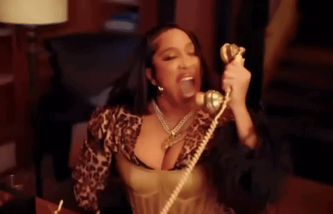 Woman in Leopard Print Top Talking on Phone