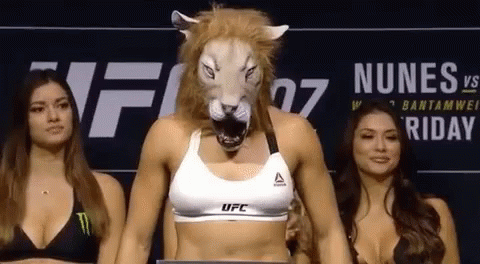 Woman in Lion Mask Standing