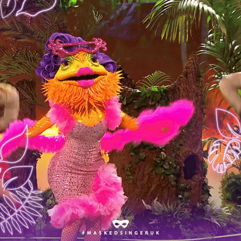Woman In Lizard Costume Dancing On Stage GIF