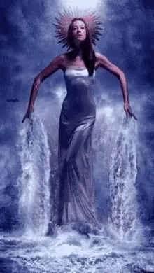 Woman in Long Dress Standing in Water