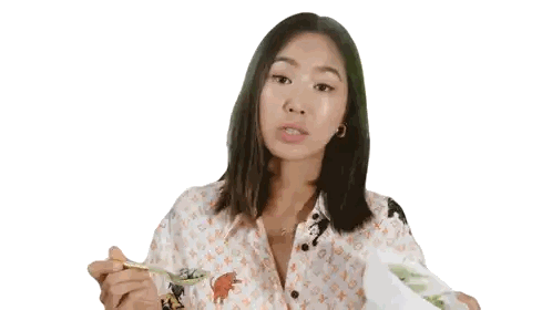 Woman in Louis Vuitton Shirt Eating Food