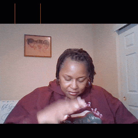Woman in Maroon Hoodie With Vibe