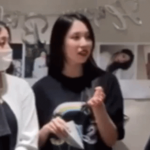 Woman in Mask and Black T-Shirt Next to Woman