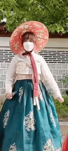 Woman in Mask and Traditional Korean Dress