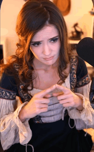 Woman In Medieval Costume Looking At Something GIF