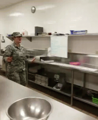 Woman in Military Uniform in Kitchen
