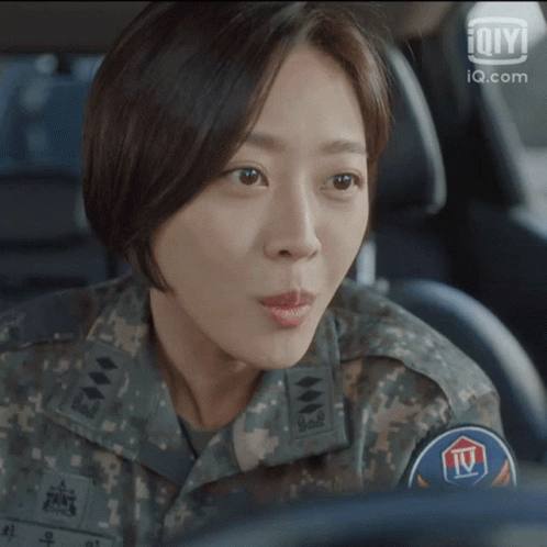 Woman in Military Uniform Sitting in Car