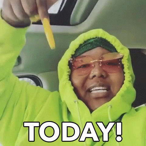 Woman in Neon Green Hoodie Holding French Fry