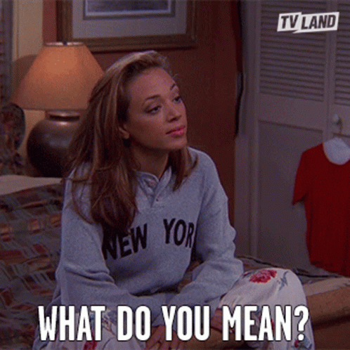 Woman in New York Sweatshirt Asking What Do You Mean