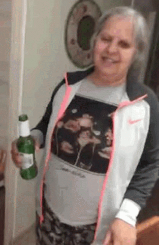 Woman In Nike Jacket Holding Beer Bottle GIF