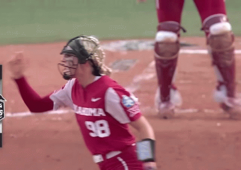 Woman in Number 98 Oklahoma Softball Jersey Celebrates