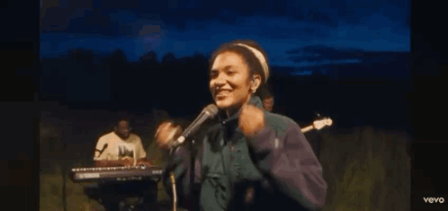 Woman In Off-Shoulder Top With O Necklace GIF