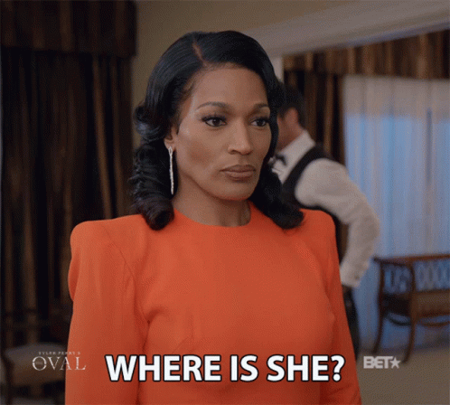 Woman In Orange Dress Asking Where GIF