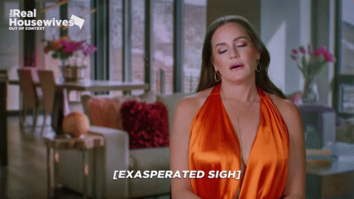 Woman in Orange Dress Exasperated Sigh