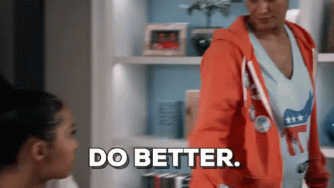 Woman in Orange Hoodie Saying Do Better