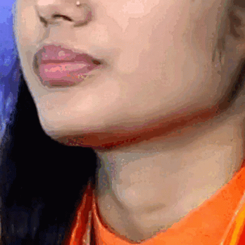 Woman in Orange Shirt Close Up