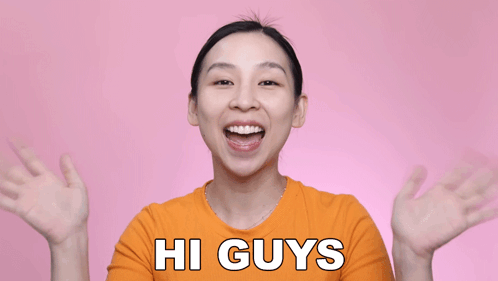 Woman in Orange Shirt Saying Hi