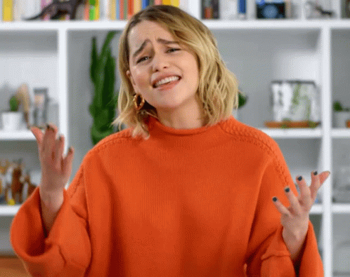 Woman in Orange Sweater Making Funny Face