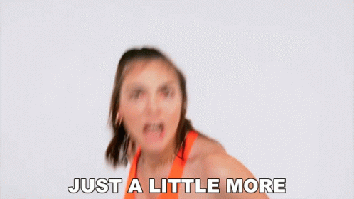 Woman in Orange Top Saying Just a Little More