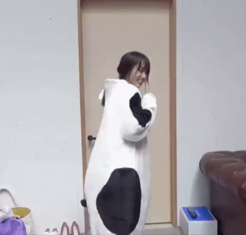 Woman In Panda Costume At Doorway GIF