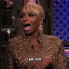 Woman In Party Hat Says I Am Rich GIF