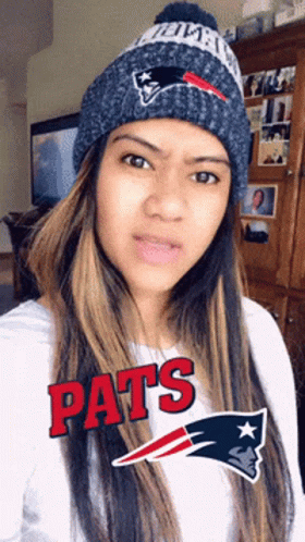 Woman in Patriots Beanie and White Shirt