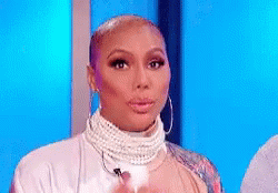 Woman in Pearl Necklace and Hoop Earrings