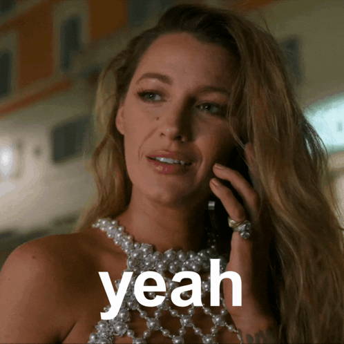 Woman in Pearl Necklace Talking on Cell Phone Saying Yeah