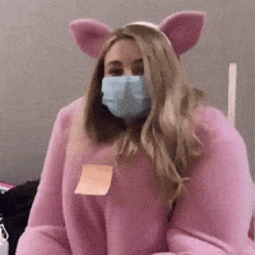 Woman In Pig Costume With Mask Holding Sticky Note GIF