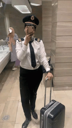 Woman in Pilot Uniform Takes Selfie