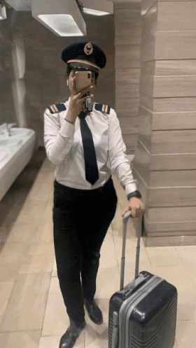 Woman in Pilot Uniform Taking Selfie